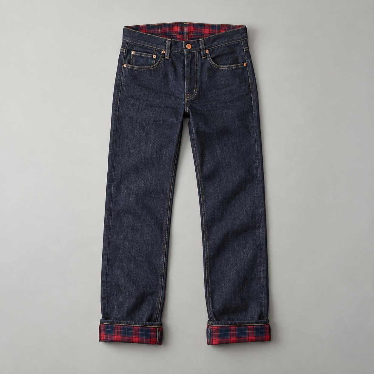 Dark indigo straight leg denim jeans with red plaid flannel lining